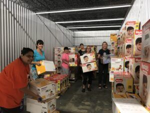 Amazing volunteers sorting diapers.